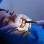 Patient receiving orthodontic treatment in a modern dental clinic, showcasing dental care techniques.